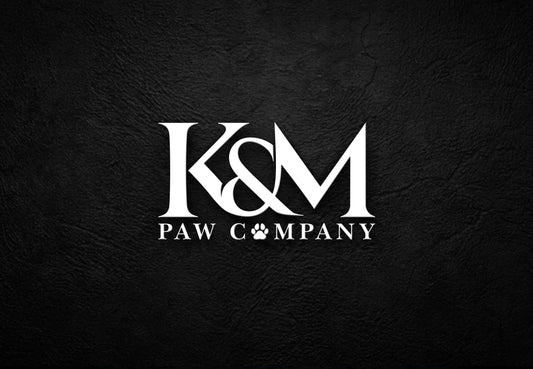 K&M Paw Co. logo in white text on a black textured background, featuring a paw print icon. Pet lifestyle brand specializing in premium apparel, jewelry, accessories, and curated pet supplies.